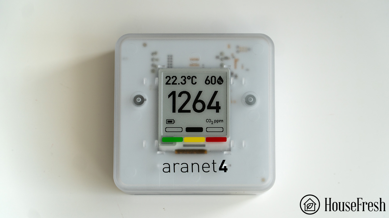 Aranet4 Home CO2 monitor with e-ink display showing carbon dioxide reading